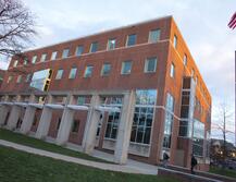An exterior view of Alexander Library showing the walkway up to the building