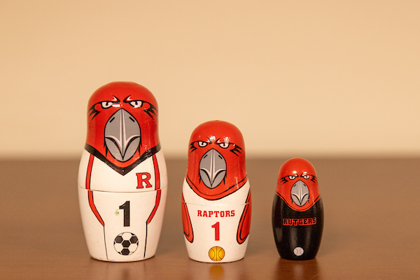 Image of three nesting Raptor dolls wearing Rutgers-Camden sports jerseys
