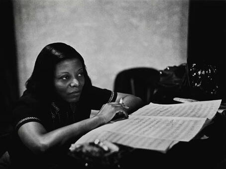 Mary Lou Williams looking at a music score