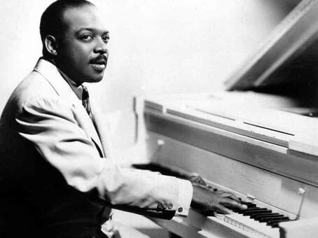 Count Basie at a  piano