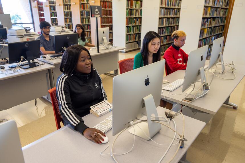 Students using Mac desktops in the Library of Science and Medicine