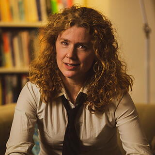 Francesca Giannetti in front of a bookshelf