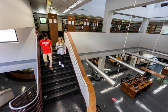 Interior of the art library showing two students walking down the stairs