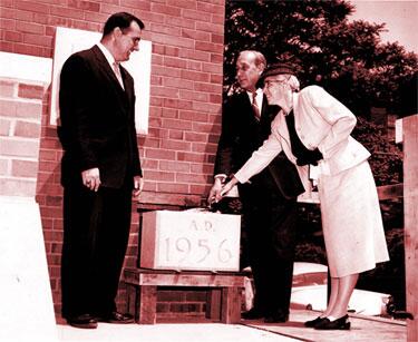 Rutgers College of South Jersey Librarian Beatrice MacCarter (in hat) lays the cornerstone with others in a ceremony held on May 13th, 1957. 