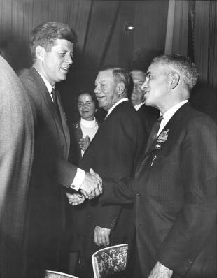 John F Kennedy shaking hands with IUE President James B. Carey