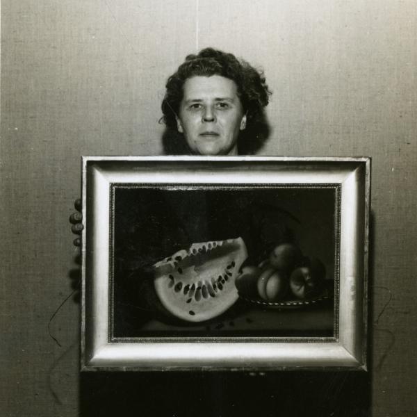 Photo of Mary holding a photo frame
