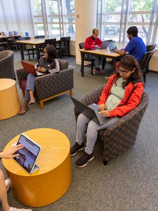 Students working in Chang library in the various forms of seating and study spaces available