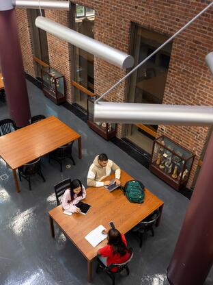 Top view of students from above in the Art library on the New Brunswick campus