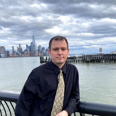 John Gibson standing at the Camden waterfront