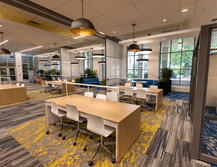 Study area with tables and moveable chairs in the new Digital Learning Commons at Alexander Library