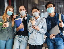 Photo of multinational students wearing face masks.