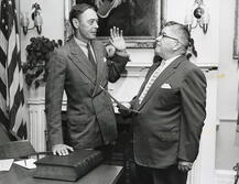 Alexander (left) takes oath as a member of the Board of Governors in 1956.