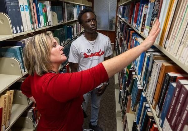 Librarian helping a patron